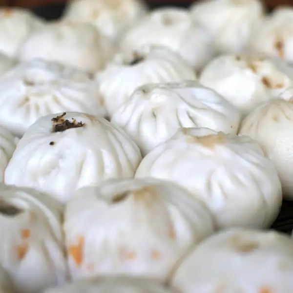 Baozi, small steamed buns filled with pork