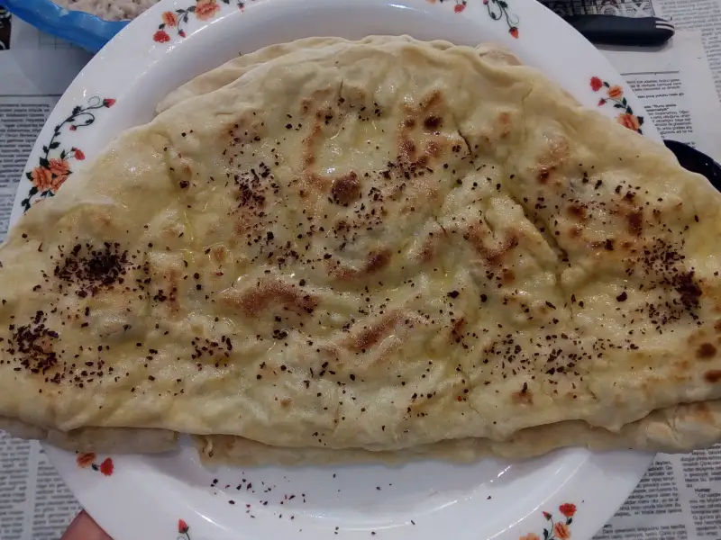 Savoury pastries filled with herbs and cheese (qutab)