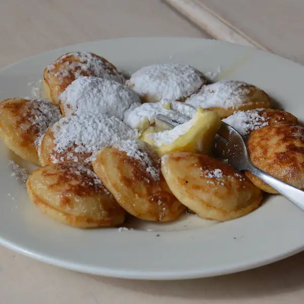 Dutch pancakes, powdered sugar, and butter